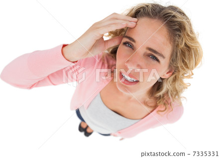Overhead of attractive woman touching her forehead 7335331