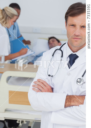 Doctor standing and looking at the camera 7335391