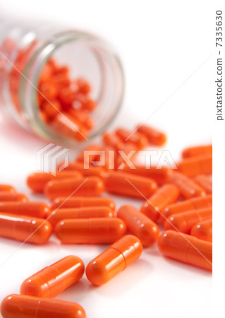 bunch of orange pills 7335630