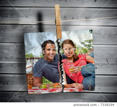 Ripped photo of couple hung with a peg Ripped photo of couple hung with a peg 7336294