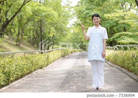 Fresh green female caregiver Fresh green female caregiver 7336994