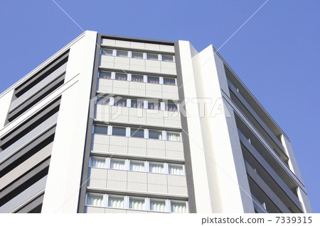 High-rise apartment and blue sky 7339315