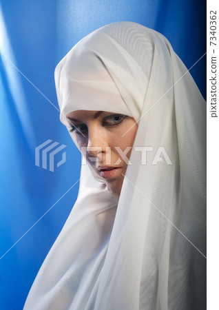 sad girl in white hijab 7340362