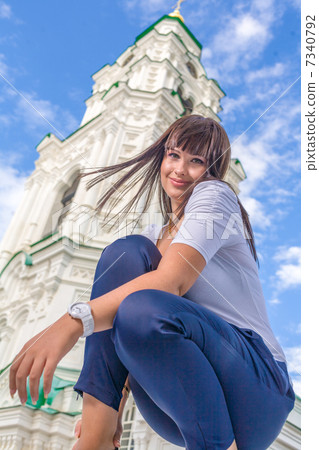 model posing in front of tall building 7340792