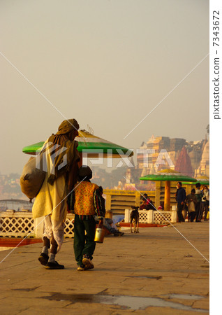 Cuddling parent and child at India, Ganges river in Varanasi Cuddling parent and child at India, Ganges river in Varanasi 7343672