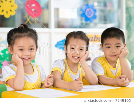 Boy and girls sitting in the kindergarten Boy and girls sitting in the kindergarten 7349105