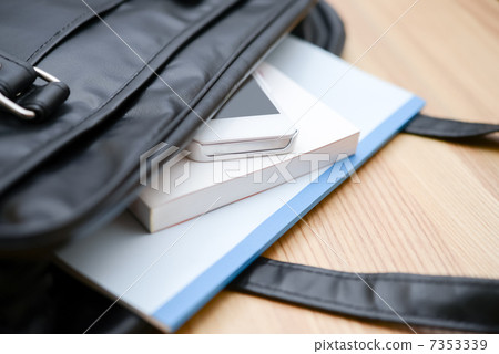 Smartphones and notes seen from school bags 7353339