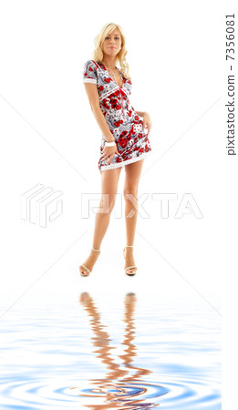 blonde in colorful dress on white sand blonde in colorful dress on white sand 7356081