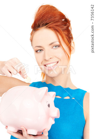lovely woman with piggy bank 7356142