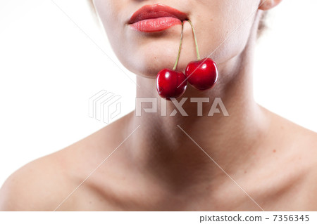 Young woman with cherry isolated on white Young woman with cherry isolated on white 7356345