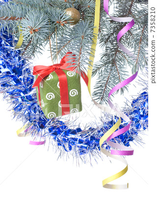 Christmas gift and decoration on fir tree branch isolated on whi 7358210