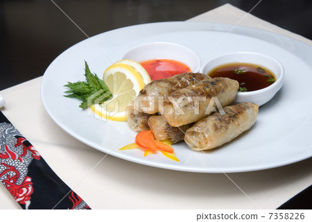 chinese rolls with meat on the plate 7358226