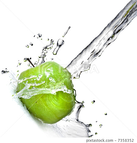 fresh water splash on green apple isolated on white fresh water splash on green apple isolated on white 7358352