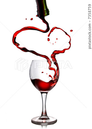 Red wine pouring in goblet from bottle in shape of heart Red wine pouring in goblet from bottle in shape of heart 7358759