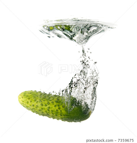green cucumber dropped into water isolated on white green cucumber dropped into water isolated on white 7359675