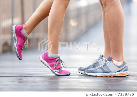 Love sport concept - running couple kissing Love sport concept - running couple kissing 7359780