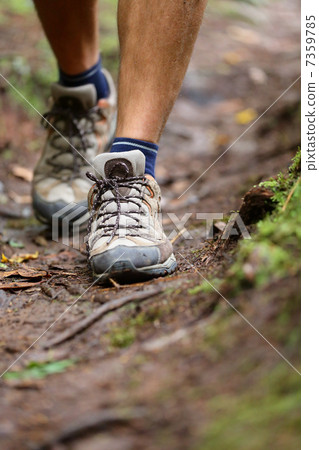 Hiker - hiking shoes closeup from hike walk Hiker - hiking shoes closeup from hike walk 7359785