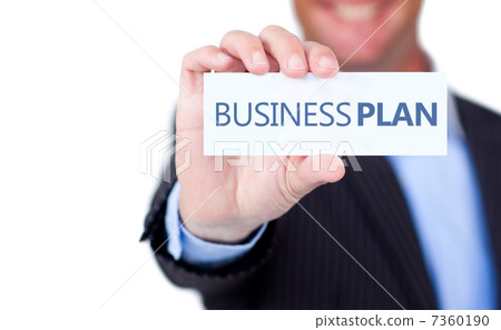 Businessman holding a label with business plan written on it Businessman holding a label with business plan written on it 7360190