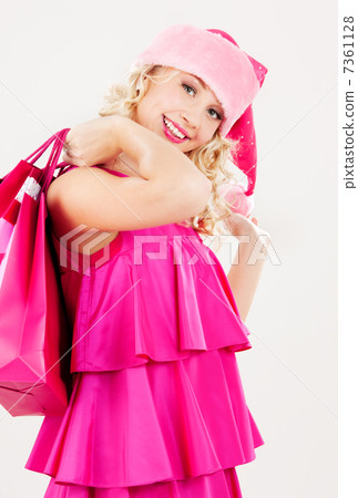 cheerful santa helper girl with shopping bags 7361128