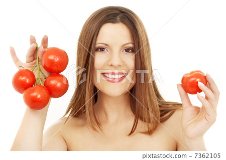 beautiful brunette girl holding tomatos 7362105