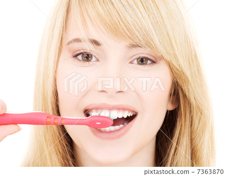 happy girl with toothbrush 7363870