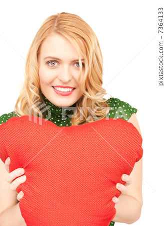woman with red heart-shaped pillow 7364133