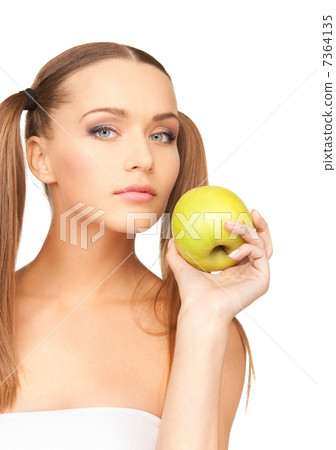 young beautiful woman with green apple 7364135