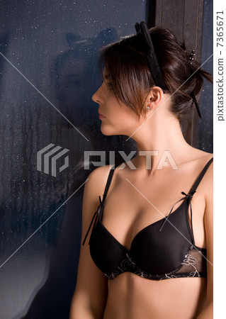 woman with cat ears at the rainy window woman with cat ears at the rainy window 7365671