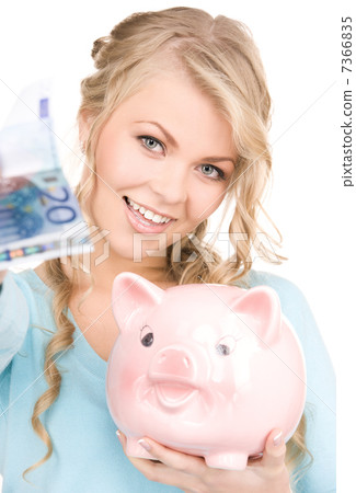 lovely woman with piggy bank and money lovely woman with piggy bank and money 7366835