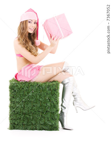 santa helper with gift box on green cube 7367052