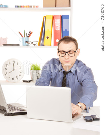 businessman with laptop computer in office 7368766