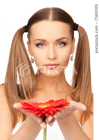 woman in towel with red flower woman in towel with red flower 7369389
