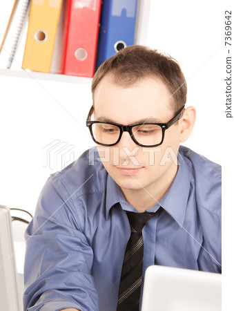 businessman with laptop computer in office 7369642