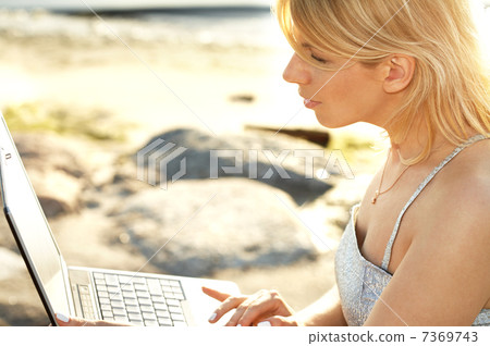 outdoor picture of blond with laptop outdoor picture of blond with laptop 7369743