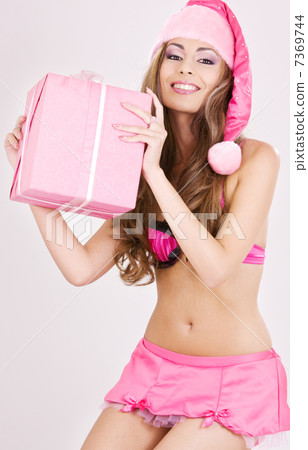 cheerful santa helper girl with gift box cheerful santa helper girl with gift box 7369744