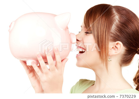 lovely teenage girl with piggy bank 7370229