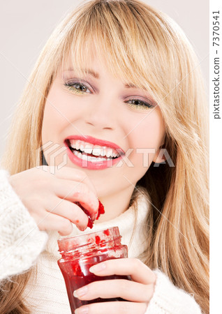 happy teenage girl with raspberry jam 7370541
