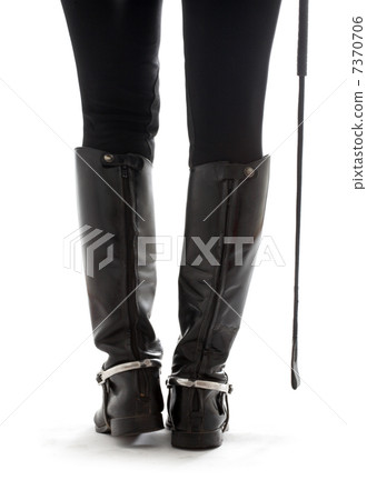 beautiful legs in black leather horseman boots with riding-crop 7370706