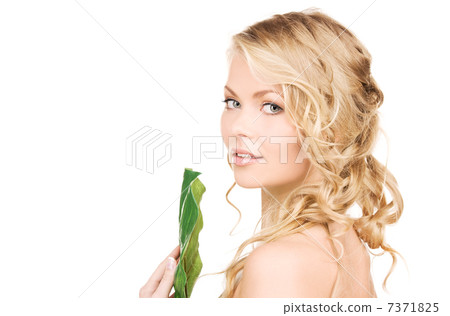 woman with green leaf 7371825