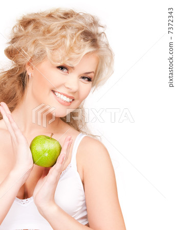 young beautiful woman with green apple young beautiful woman with green apple 7372343