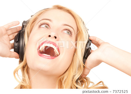 happy woman in headphones 7372525