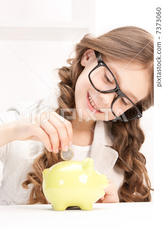 little girl with piggy bank and coin little girl with piggy bank and coin 7373060