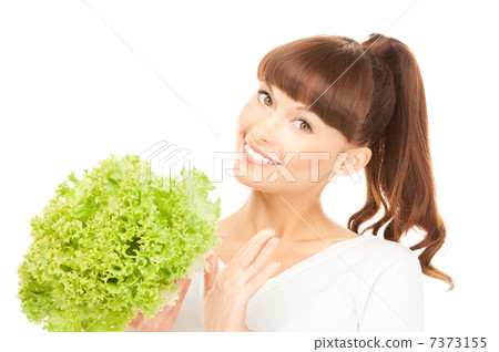 beautiful housewife with lettuce over white beautiful housewife with lettuce over white 7373155