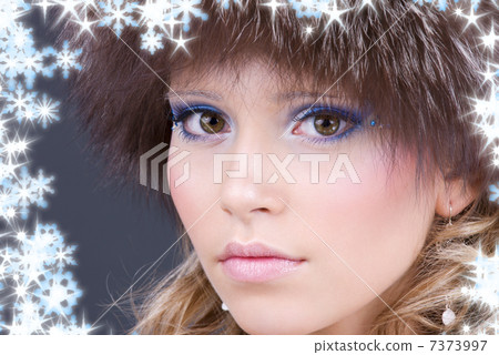 lovely woman in furry hat over grey lovely woman in furry hat over grey 7373997