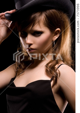 woman in black dress and top hat woman in black dress and top hat 7373998