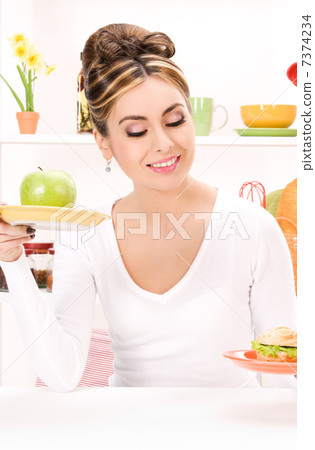 woman with green apple and sandwich woman with green apple and sandwich 7374234