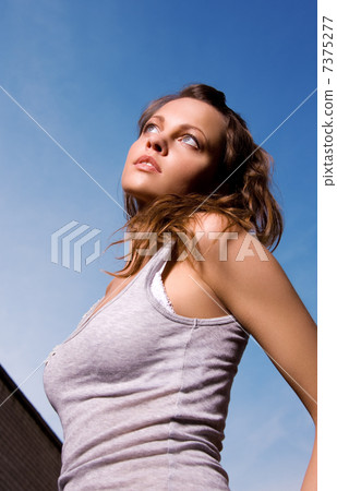 young sexy woman in grey shirt 7375277