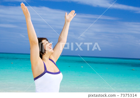 happy woman on the beach happy woman on the beach 7375314