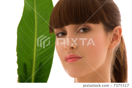 woman with green leaf woman with green leaf 7375317