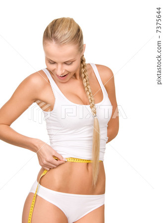 beautiful woman with measure tape 7375644